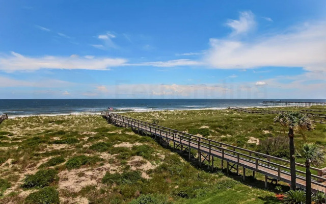 Newly Remodeled Oceanfront Condo with Salt Water Pool and Private Walkway to Beach by RedAwning
