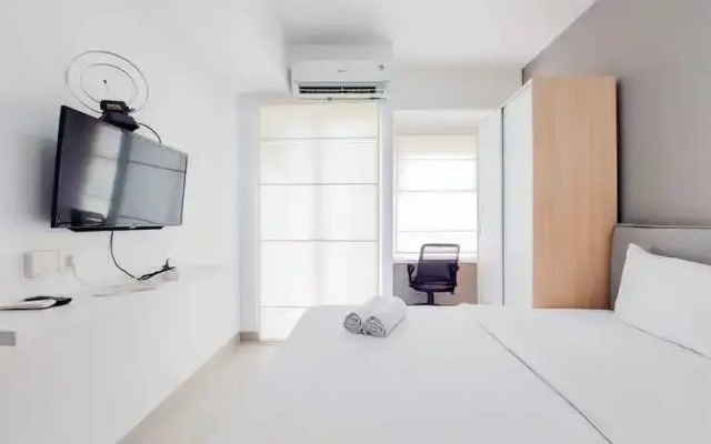 Homey and Fully Furnished Studio Serpong Garden Apartment By Travelio