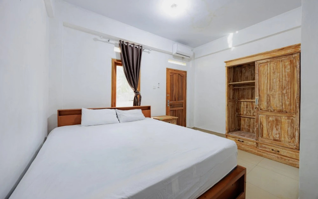 Soka Asri Guest House near Bali Zoo RedPartner – Guest Rooms – Denpasar
