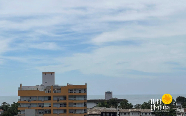 Apto completo e confortável com roupa de cama nas Toninhas  Condomínio Lumière