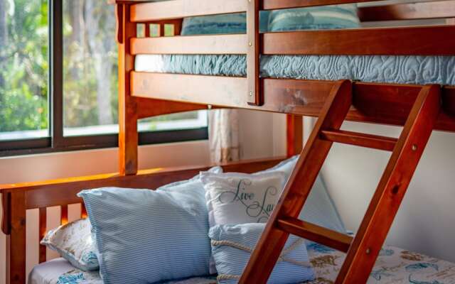 Ultramodern Townhome with an Inviting Coastal Design and Lush Outdoor Oasis with a Private Pool