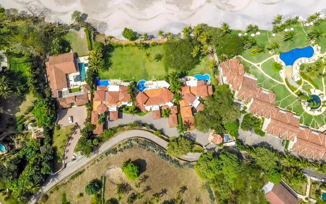 Mediterranean-style Flamingo Mansion Offers the Ultimate in Beachfront Luxury