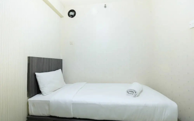 Monochrome Style 2 Bedrooms at Kalibata City Apartment By Travelio