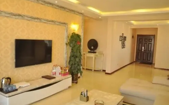Huazhong Theme Apartment Hotel