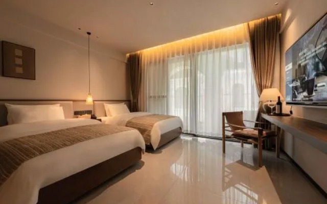 Xishuangbanna Jinghong Yakatu Theme Inn (Mengle Dafo Temple)