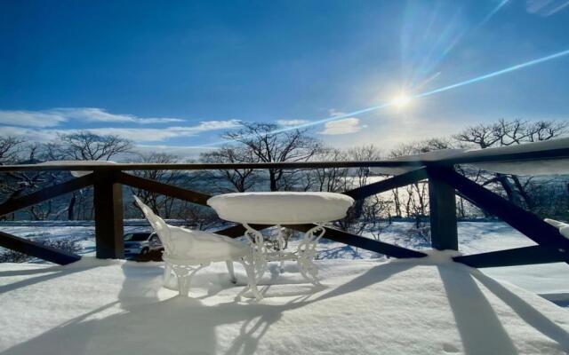 Yellow House by Lake Toya