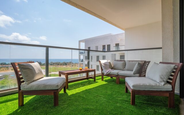 Vibrant Seaside Stay with Balcony by Sea N' Rent