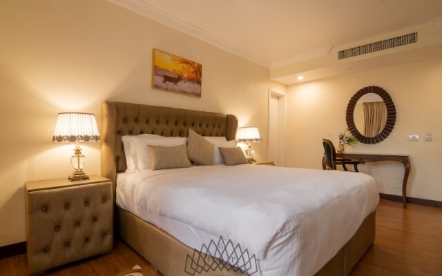 The Grand Palace Suites & Hotel