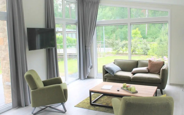 Modern chalet with a dishwasher, near a pond