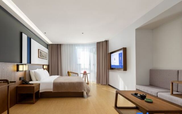 Qianna Meisu Hotel (Xinxiang Municipal Government High-speed Railway Station)