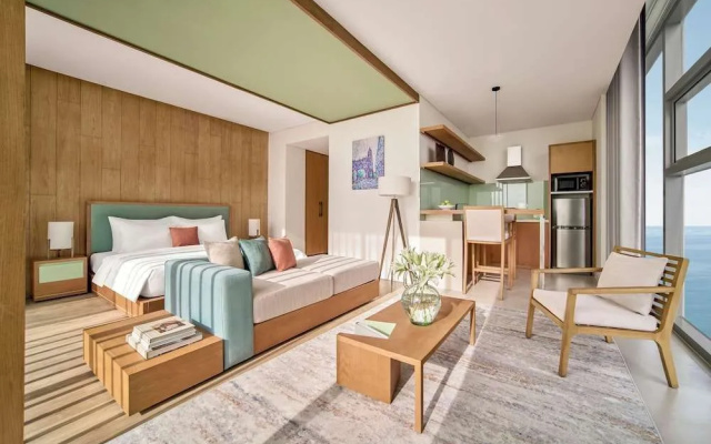 Signature By M Village Beachfront Hotel