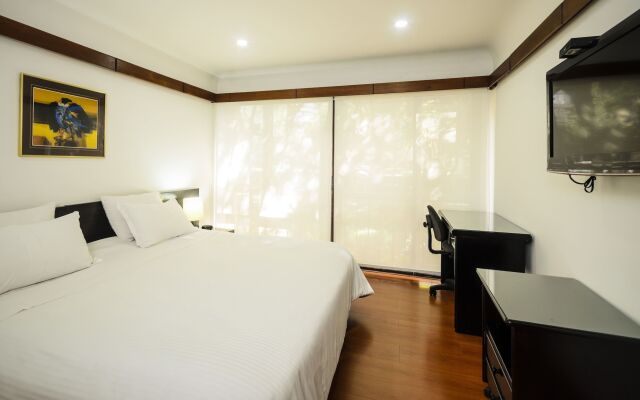 Travelers Suites Condominio Plenitud