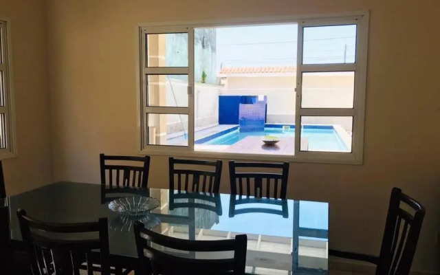 Casa de praia com piscina e churrasqueira - Indaiá Bertioga