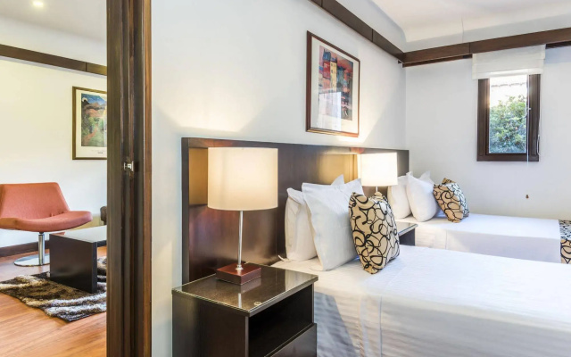 Travelers Suites Condominio Plenitud