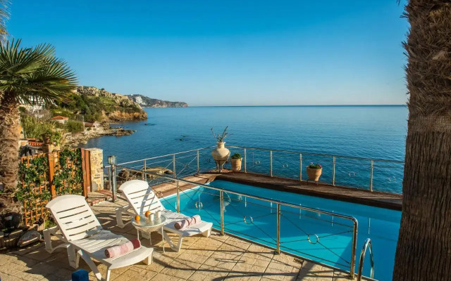 Exclusive Seaside Retreat with Shared Pool & Private Beach Access