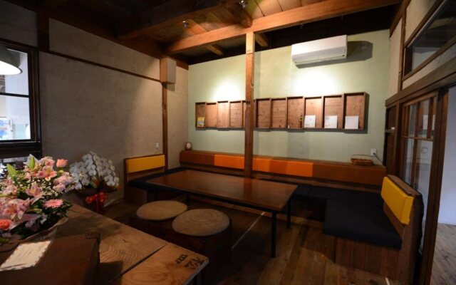 Taketa station hostel cue