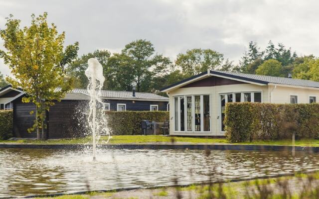 Comfy Chalet With a Dishwasher, Directly on a Pond