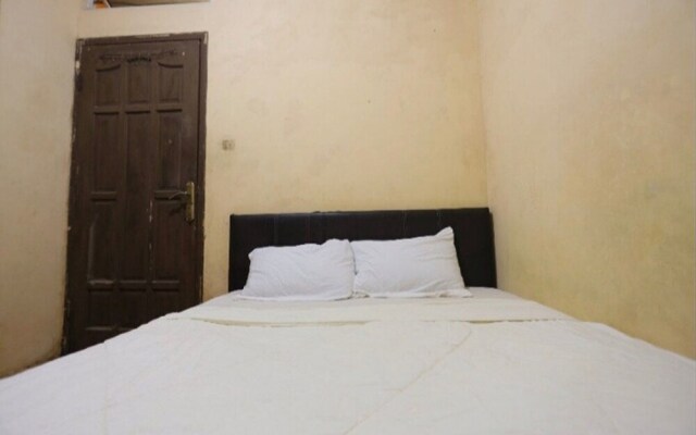SPOT ON 93460 Lewi Family Guest House Near GBKP Bangun Mulia Km. 11