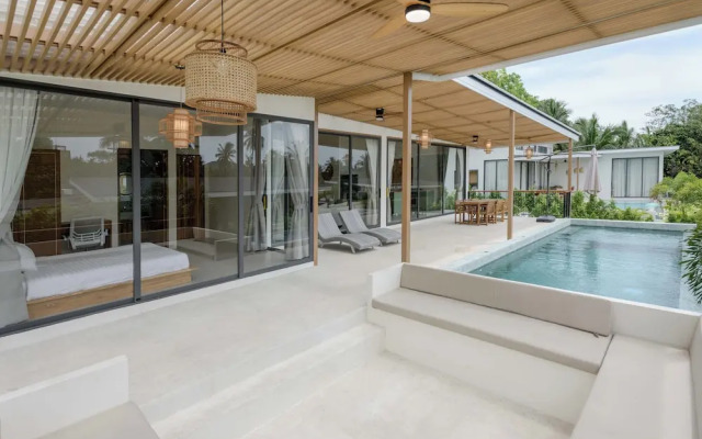 Tropical Poolside Retreat by Sea N' Rent