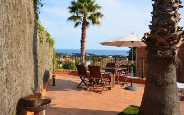 4 bedrooms house with sea view enclosed garden and wifi at Lloret de Mar 1 km away from the beach