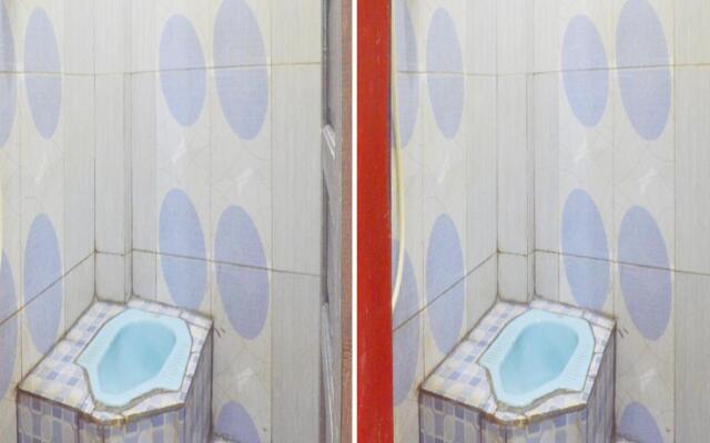 SPOT ON 91623 Pj Guest House Syariah