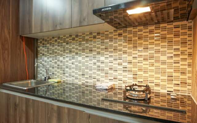 Warm and Cozy Studio at Puri Orchard Apartment