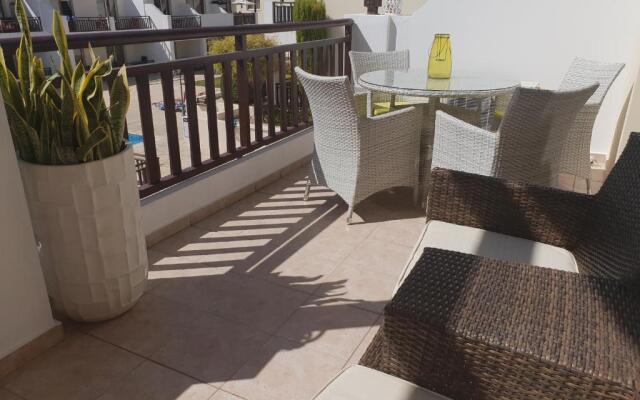 Stunning apartment C106 with balcony looking over pool