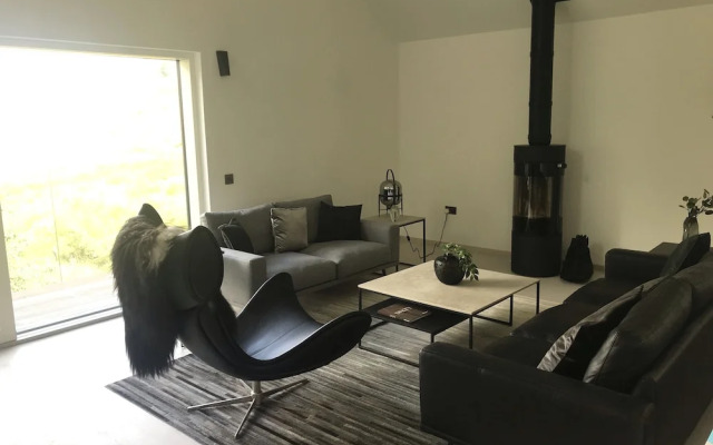 Red Stag With Stunning Loch and Waterfall View