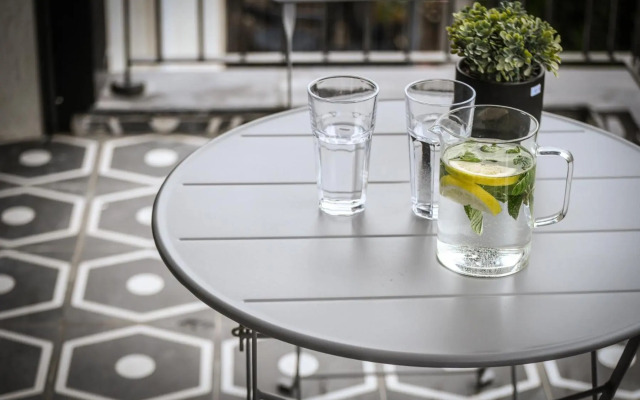 Stylish 2BR Apartment with Balcony and Urban View