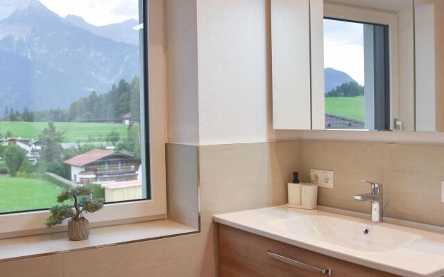 Apartment in Götzens with roof terrace and e-car charging station