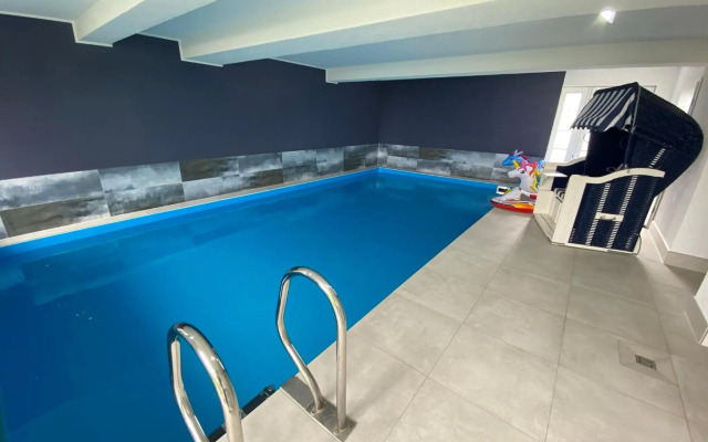 Ferienwohnung im Poolhaus mit Ostseeblick