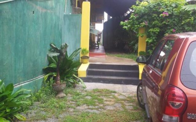 Malikas Yellow House