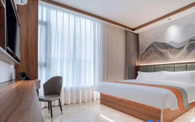 Wu Ming Holiday Hotel -LRB-bus statKangkang he city hotel