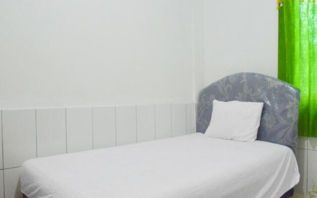 SPOT ON 91623 Pj Guest House Syariah