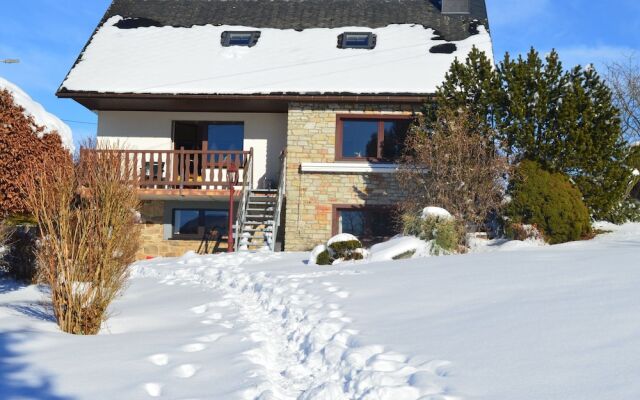 House With Beautiful Wooden Balcony Located Against the Hills