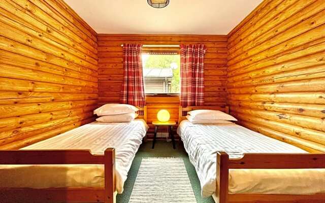 Riverside log cabins