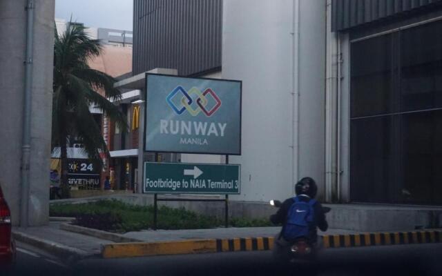 Palm Tree Condos across NAIA3 by Beth