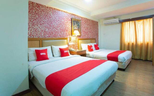 Capital O Hotel Grand Orchard