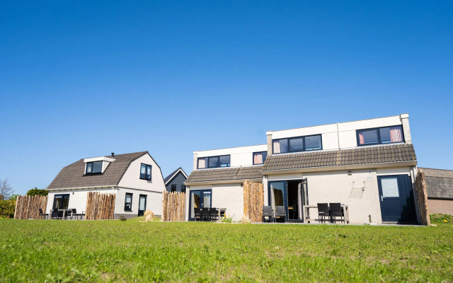 Cozy house with an unobstructed view of a holiday park located on Texel