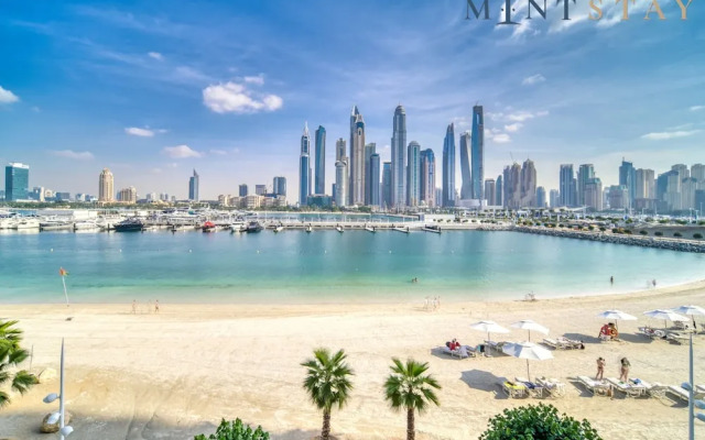 Elegant 2BR Emaar Beachfront Retreat