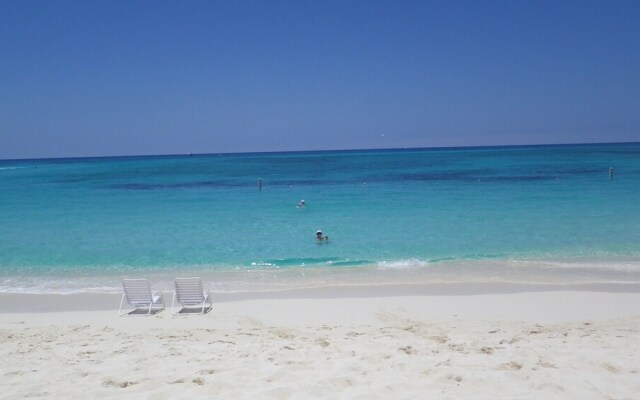 Sunrise Waterways by Cayman Vacation