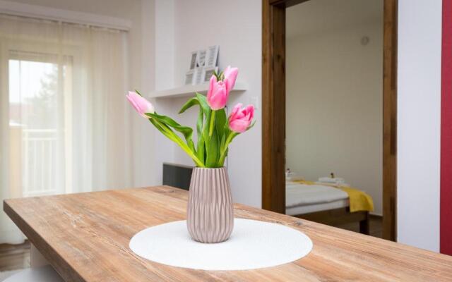 Aqualiget-Apartmanház