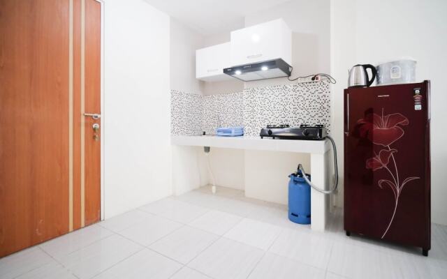 Cozy Living And Tidy 2Br At Puncak Dharmahusada Apartment