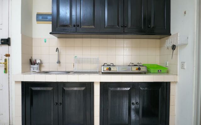 Clean and Homey 1BR at Puri Garden Apartment