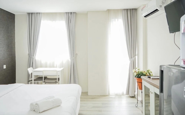 Compact and Monochrome Studio Room Bintaro Icon Apartment