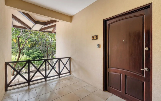 Modern Island-Themed Condo with Floor-to-Ceiling Windows & Garden and Pool Views Within Walking Distance of the Beach