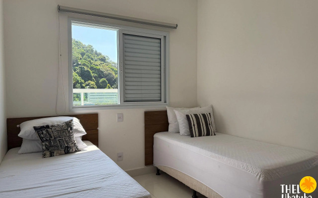 Apto completo e confortável com roupa de cama nas Toninhas  Condomínio Lumière