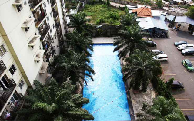 Clean 2BR with Pool View Mutiara Bekasi Apartment By Travelio