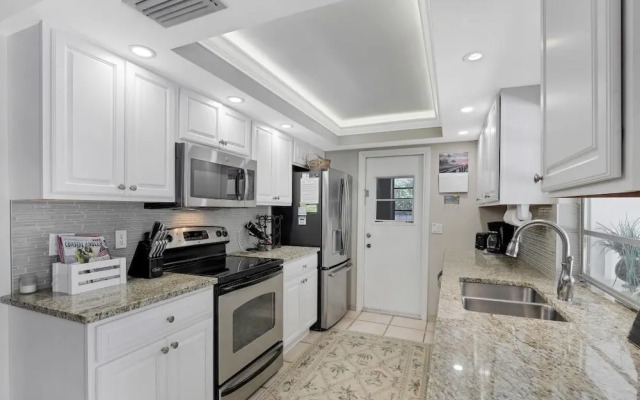 Cozy Home With Sunroom, Pool and Steps to Beach