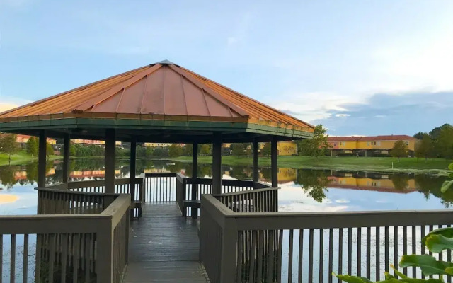 Private Screened Splash Pool Overlooking Tranquil Lake Right Beside Disney World by Florida Dream Homes